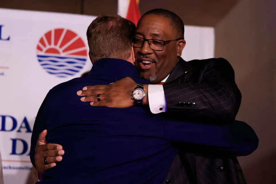 Republican mayoral candidate Daniel Davis hugs Jacksonville Sheriff T.K. Waters during an election night gathering on March 21.