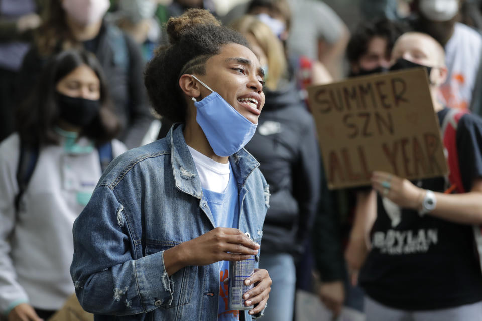 FILE - A person speaks during a rally near the King County Courthouse, Wednesday, July 22, 2020, in Seattle, to call for justice in the death of Summer Taylor, who was killed earlier in the month when they were hit by a car driven by Dawit Kelete while taking part in a Black Lives Matter protest on a closed Seattle freeway in a crash that also seriously injured protester Diaz Love. The Seattle Times reports 30-year-old Kelete pleaded guilty on Thursday, July 27, 2023, to vehicular homicide in the death of Summer Taylor. He also pleaded guilty to vehicular assault and reckless driving charges. (AP Photo/Ted S. Warren, File)