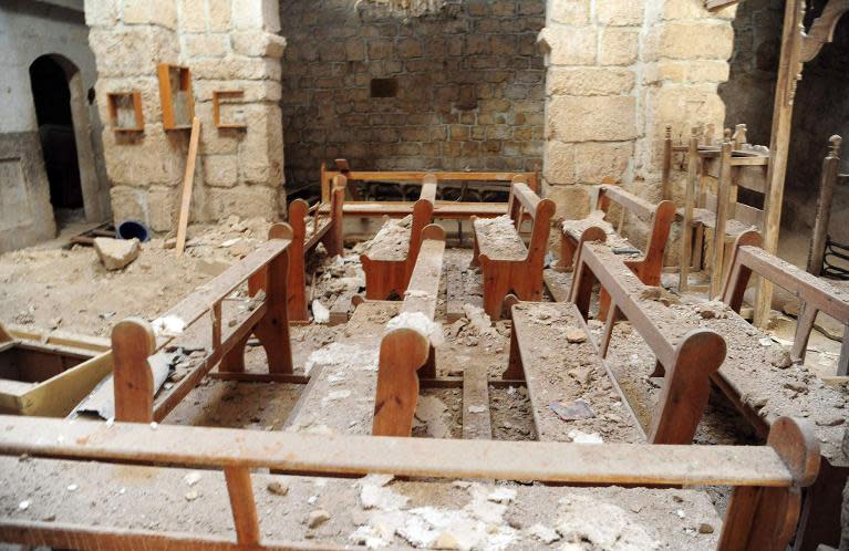 A general view taken on April 14, 2014 shows damage inside the Mar Sarkis Greek Catholic monastery in the ancient Christian town of Maalula, northeast of Damascus, after government forces took control of the town