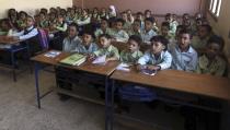 Students attend a class on the first day of their new school year at a government school in Giza, south of Cairo September 22, 2013. Students resumed their studies at the beginning of the new academic year this weekend amid parental concerns of a possible lack of security after the summer vacation ends. REUTERS/Mohamed Abd El Ghany (EGYPT - Tags: POLITICS EDUCATION)