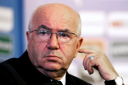 FILE PHOTO: Italian Football Federation President Carlo Tavecchio attends a media conference during the official presentation of new Italy coach Antonio Conte (unseen) in Rome August 19, 2014. REUTERS/Alessandro Bianchi/File Photo