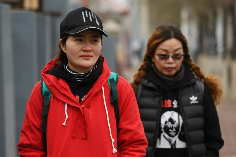 Li Wenzu (L), with supporter Lin Ermin, has had little news of her husband since he was detained in a police sweep nearly three years ago