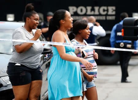 A group of women emerges from the hospital after an incident in which a gunman fired shots inside the Bronx-Lebanon Hospital in New York City, U.S. June 30, 2017. REUTERS/Brendan Mcdermid