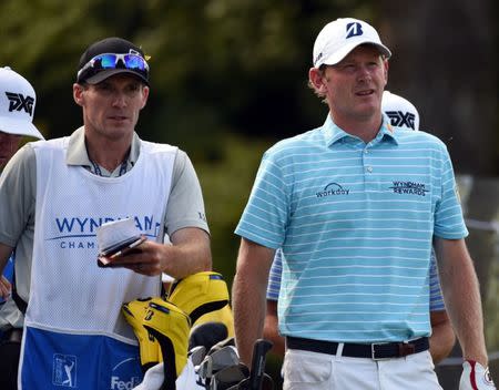 Aug 17, 2018; Greensboro, NC, USA; Brandt Snedeker (right) and caddie Travis Perkins study the sixteenth hole during the second round of the Wyndham Championship golf tournament at Sedgefield Country Club. Mandatory Credit: Rob Kinnan-USA TODAY Sports