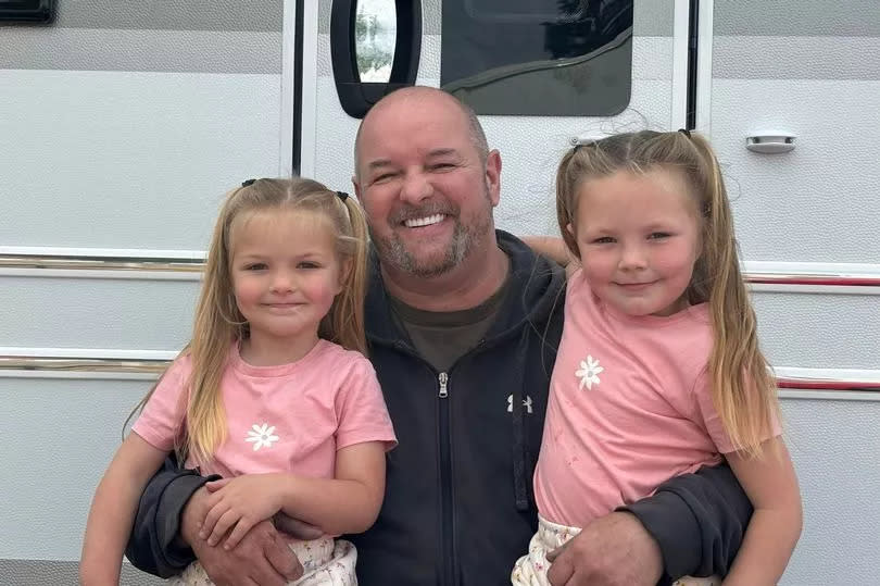 Amos with his granddaughters Brooklyn and Naveah