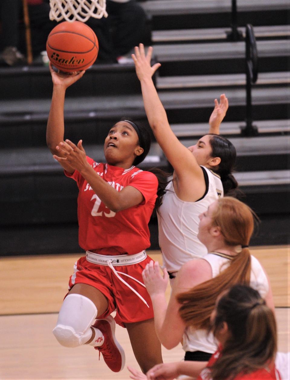 Sweetwater's Aunisti Griffin (23) drives to the basket against the Abilene High defense in the second half. AHS won the nondistrict game 59-26 on Monday, Nov. 22, 2021 at Eagle Gym.