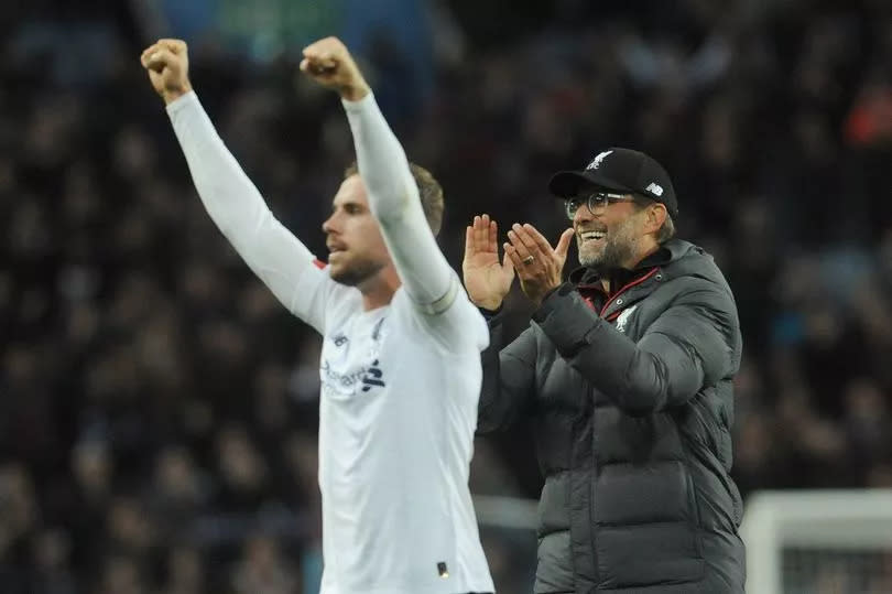 BIRMINGHAM, ENGLAND – NOVEMBER 02: Jurgen Klopp, manager of Liverpool, celebrates with Jordan Henderson at the final whistle during the Premier League match between Aston Villa and Liverpool FC at Villa Park on November 2, 2019 in Birmingham, United Kingdom.  (Photo by Ian Cook – CameraSport via Getty Images)