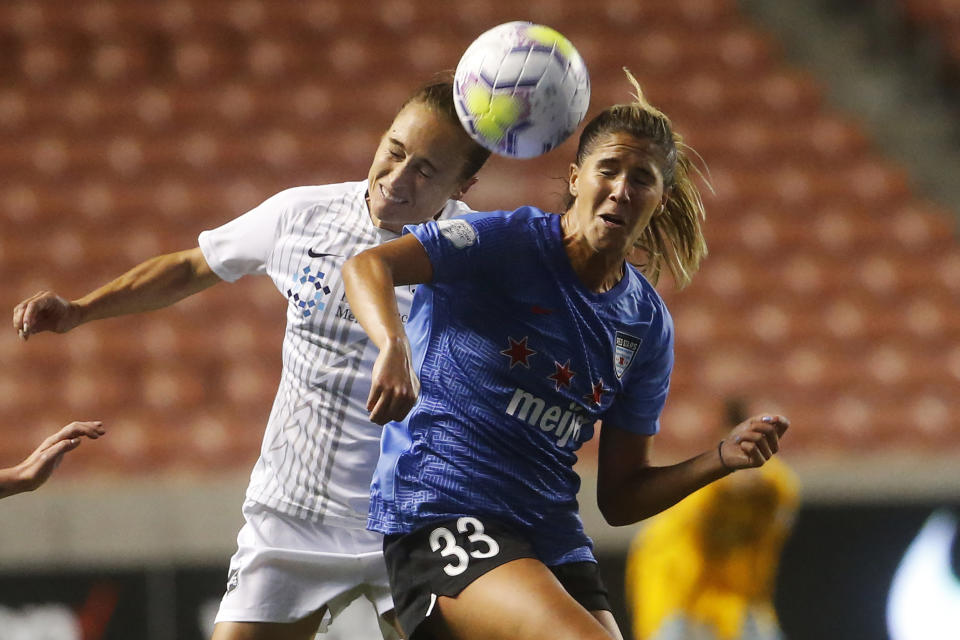 Sky Blue's Gina Lewandowski, left, and Chicago Red Stars' Katie Johnson (33) battle for the ball during the second half of an NWSL Challenge Cup soccer semifinal match Wednesday, July 22, 2020, in Sandy, Utah. (AP Photo/Rick Bowmer)