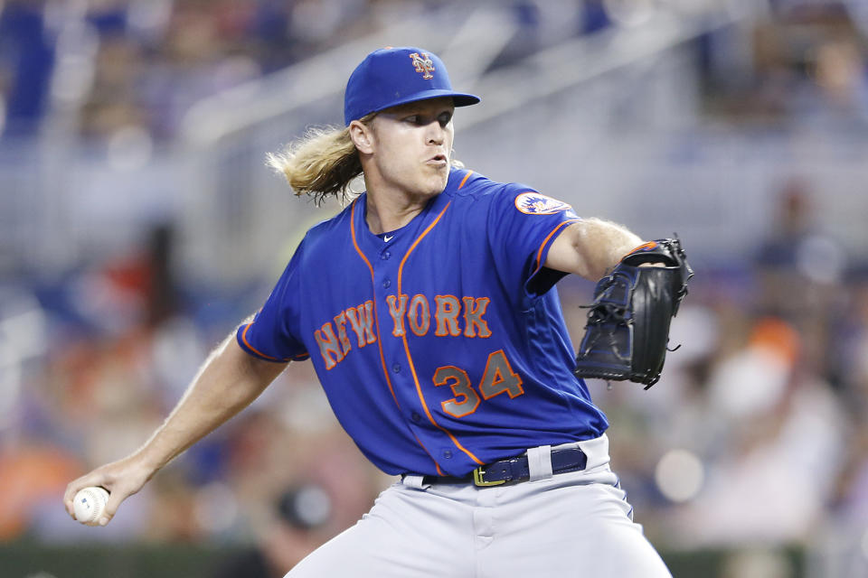 MIAMI, FLORIDA - JULY 13:  Noah Syndergaard #34 of the New York Mets delivers a pitch in the first inning against the Miami Marlins at Marlins Park on July 13, 2019 in Miami, Florida. (Photo by Michael Reaves/Getty Images)