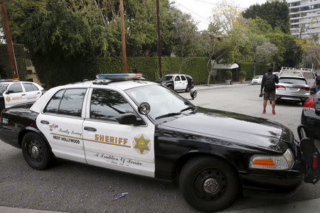 An LA County Sheriff's Department patrol car sits outside the Sunset Marquis hotel where U2 tour manager Dennis Sheehan was pronounced dead in his hotel room, according to local media, in West Hollywood, California May 27, 2015. REUTERS/Patrick T. Fallon