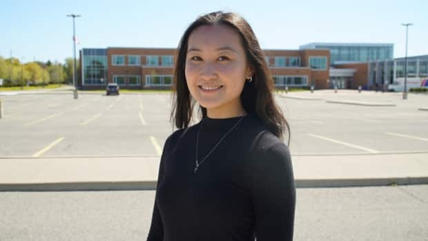 The pandemic hit right in the middle of Charis Liu's Grade 11 year at Markham District High School. That means she and her cohort have only had two-and-a-half years of 'normal' high school.  (Keith Burgess/CBC News  - image credit)