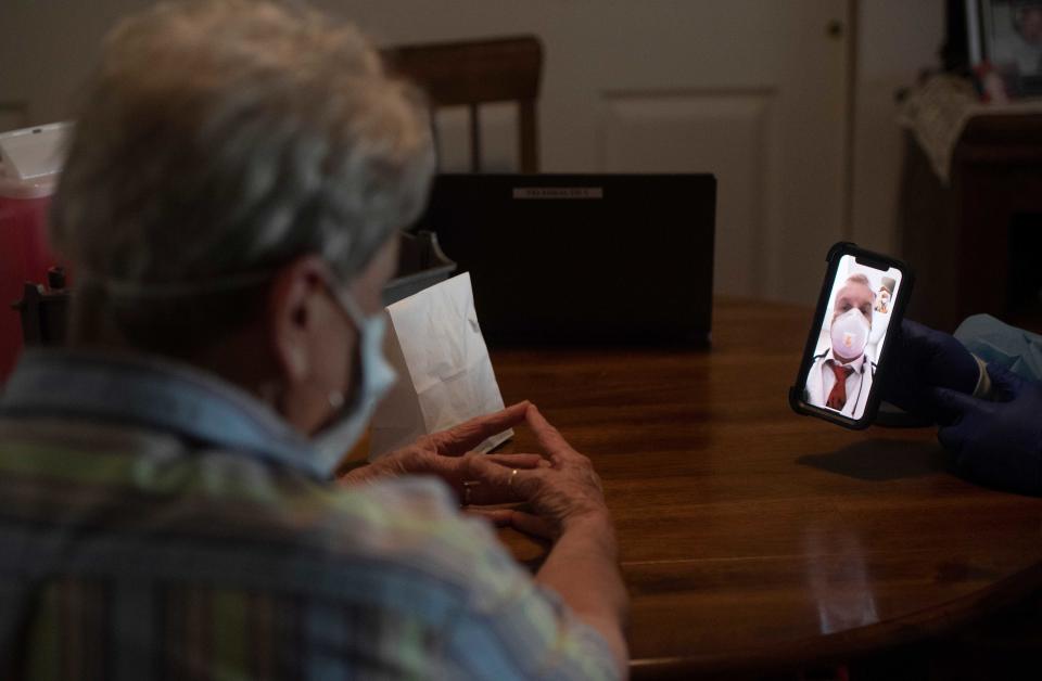 Campaigners have criticised digital visits, saying people with dementia often don't know how to use the device, and care homes often don't have the resources to provide them. (PA)