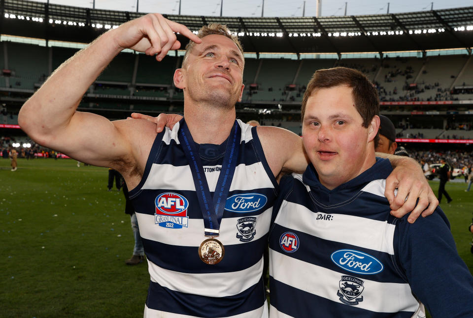 Seen here, Geelong captain Joel Selwood shares a post-grand final moment with Cats super-fan Sam Moorfoot.