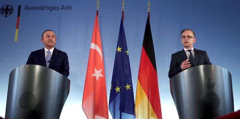 German Foreign Minister Heiko Maas and Turkish Foreign Minister Mevlut Cavusoglu address the media during a joint news conference after a meeting in Berlin