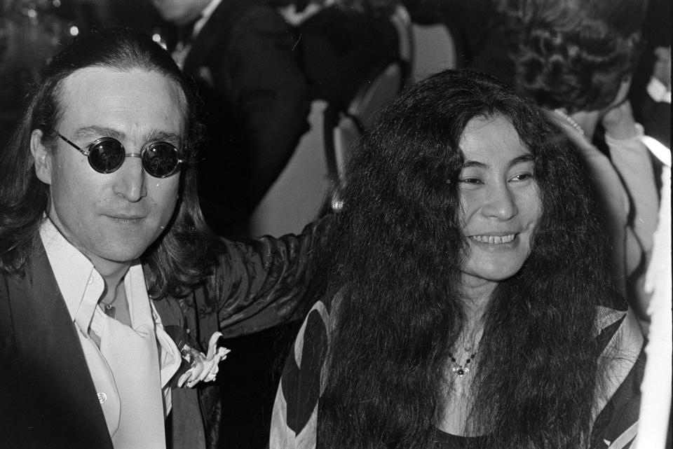 John Lennon (L) and Yoko Ono attend an Academy of Television Arts and Sciences dinner at the Hilton Hotel in New York City on April 18, 1975. (Photo by Pierre Schermann/WWD/Penske Media via Getty Images)