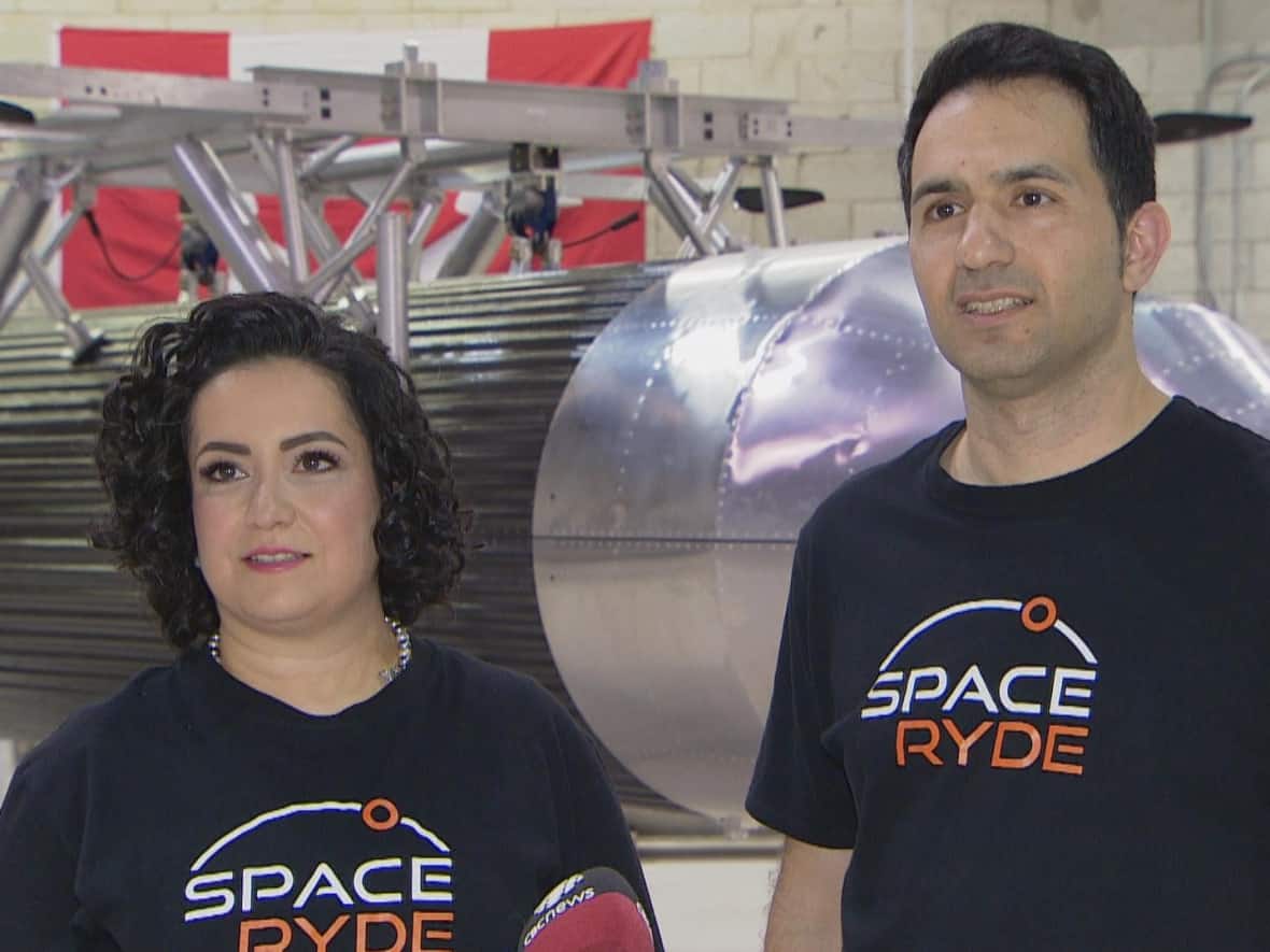 The husband-wife team that founded SpaceRyde, Saharnaz Safari, left, and Sohrab Haghighat, right, spoke to CBC News at the headquarters of what they say is Canada's first and only rocket factory. (Chris Langenzarde/CBC - image credit)