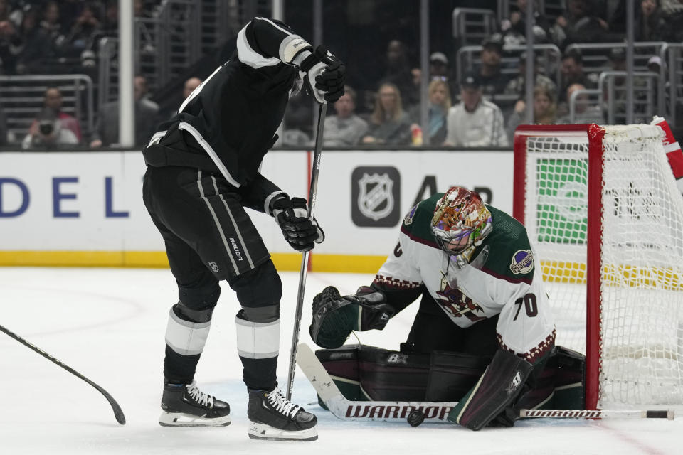 Arizona Coyotes goaltender Karel Vejmelka (70) stops a shot by Los Angeles Kings left wing Pierre-Luc Dubois during the second period of an NHL hockey game Tuesday, Oct. 24, 2023, in Los Angeles. (AP Photo/Ashley Landis)