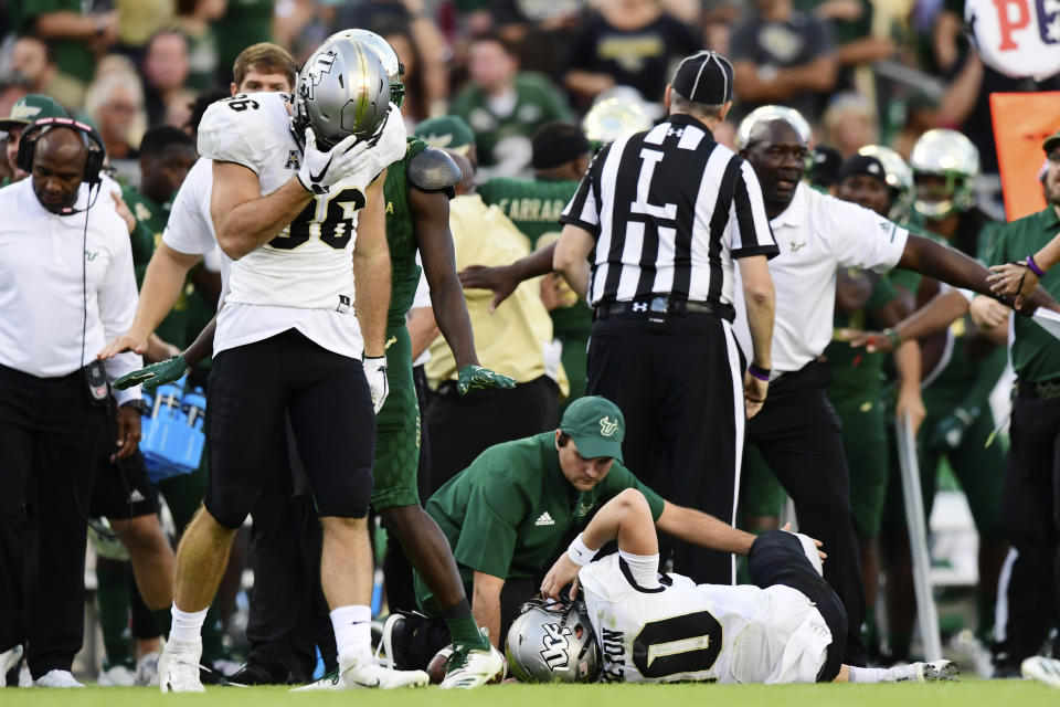 UCF's Michael Colubiale (86) reacts to McKenzie Milton's injury against South Florida in November. (Getty)