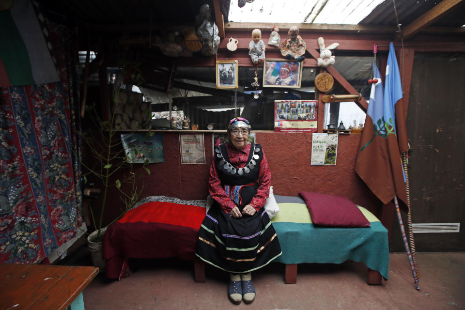 Irma Rohe Cardenas, a Mapuche midwife, poses for a photo at her home in Osorno, Chile, Sunday, Aug. 21, 2022. Rohe first assisted a birth in the hospital’s delivery room five years ago. (AP Photo/Luis Hidalgo)