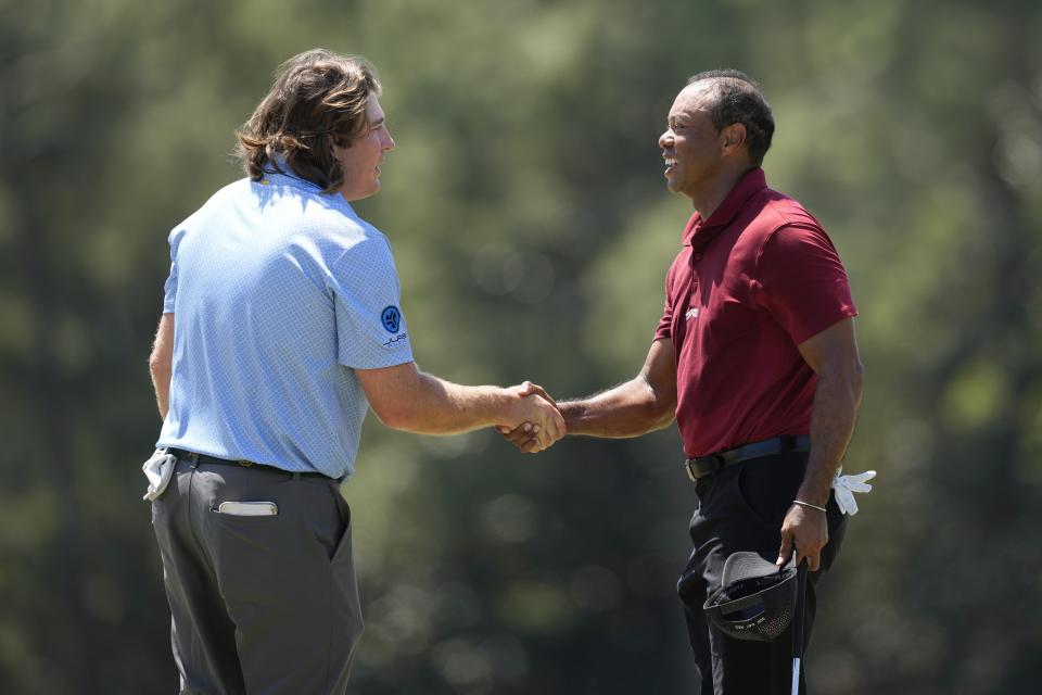 Tiger Woods shakes hand with Neal Shipley after their final round at the Masters golf tournament at Augusta National Golf Club Sunday, April 14, 2024, in Augusta, Ga. (AP Photo/David J. Phillip)