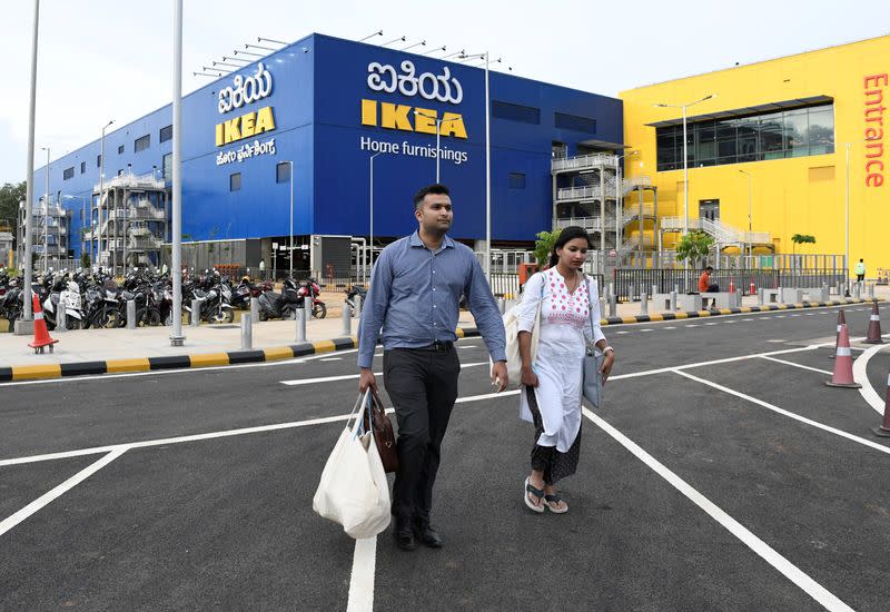 Shoppers walk outside IKEA's new store in Bengaluru