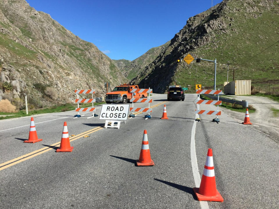 This photo released by the The California Highway Patrol shows a closed road due to multiple large boulders blocking California State Route 178 in the Canyon area in the mountains northeast of Bakersfield, Calif., Wednesday, March 6, 2019. Boulders are still falling onto the roadway. Caltrans is estimating SR-178 will be closed for a couple days. CHP reported numerous incidents of roadway flooding in the mountains northeast of Bakersfield and in areas of the San Joaquin Valley, as well as in the Owens Valley at the foot of the Eastern Sierra and in Death Valley National Park. (California Highway Patrol via AP)