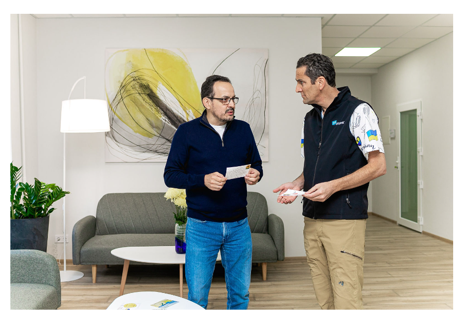 Oleh Berezyuk, director of the Lviv National Mental Health Center, left, chats with JustAnswer CEO Andy Kurtzig during the center's grand opening in October 2022. Berezyuk said more than a third of its patients are those serving in the military.