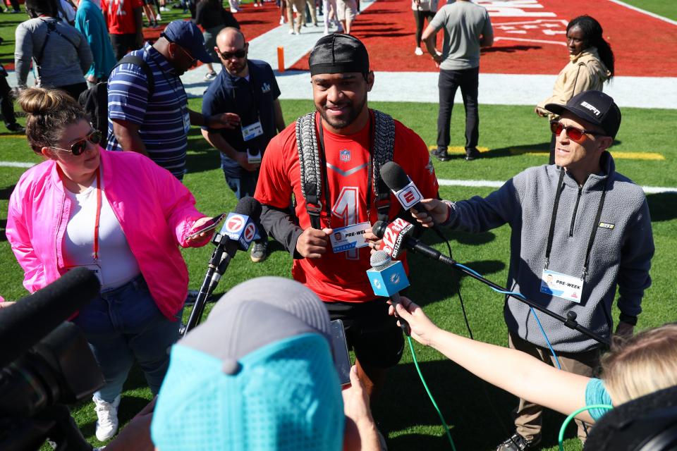 The oddsmakers do not believe in Tua Tagovailoa, shown during a Pro Bowl press conference, and the rest of the Dolphins looking ahead to the 2024 NFL season.