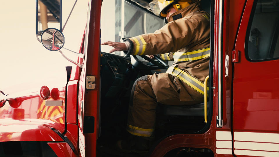 firefighter opening fire truck