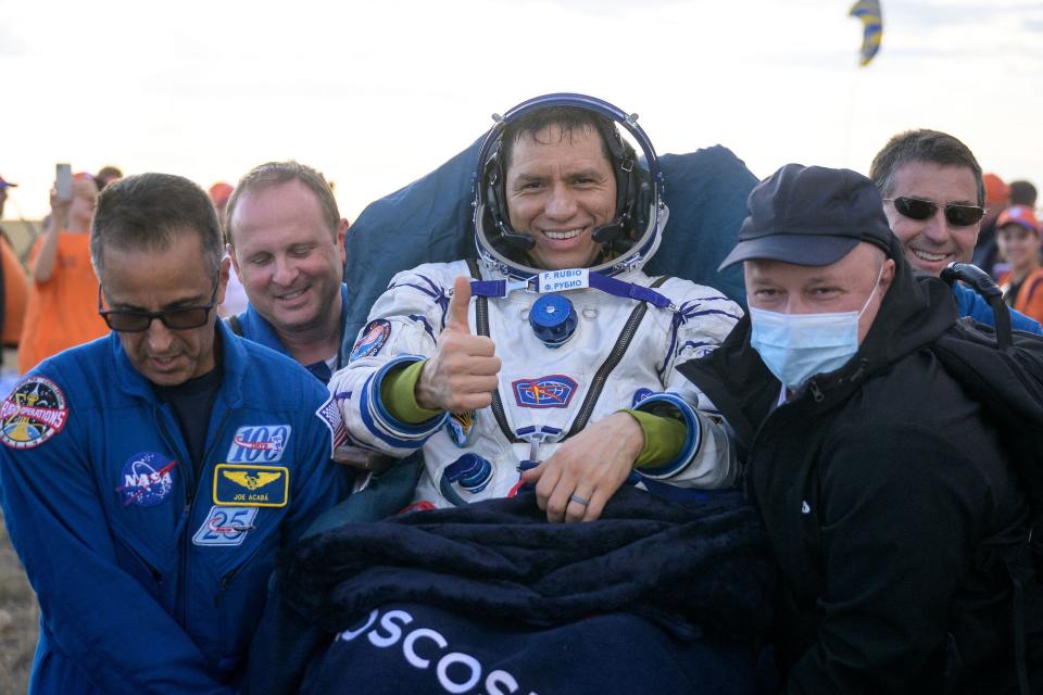 NASA astronaut Frank Rubio gives a thumbs up as he is carried to a medical tent after his landing Wednesday in a remote area of Kazakhstan. Rubio logged 371 days in space aboard the International Space Station, the longest single spaceflight by a US astronaut.