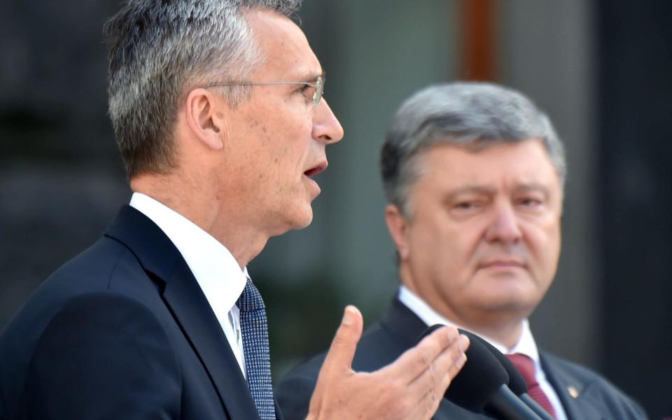 Petro Poroshenko, right, and Jens Stoltenberg in Kiev - AFP