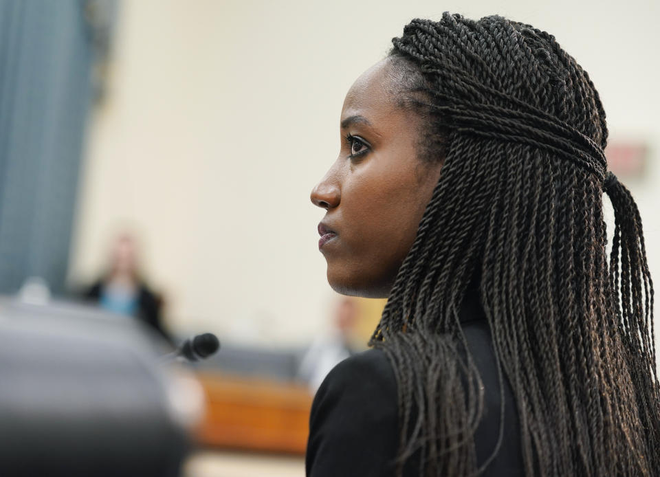 Carine Kanimba listens during a House Intelligence Committee hearing on Commercial Cyber Surveillance, Wednesday, July 27, 2022, on Capitol Hill in Washington. Kanimba and technology experts urged Congress to oppose the use of commercial spyware in the U.S. and discourage investment in spyware that has been used to hack the phones of dissidents, journalists, and even U.S. diplomats. (AP Photo/Mariam Zuhaib)