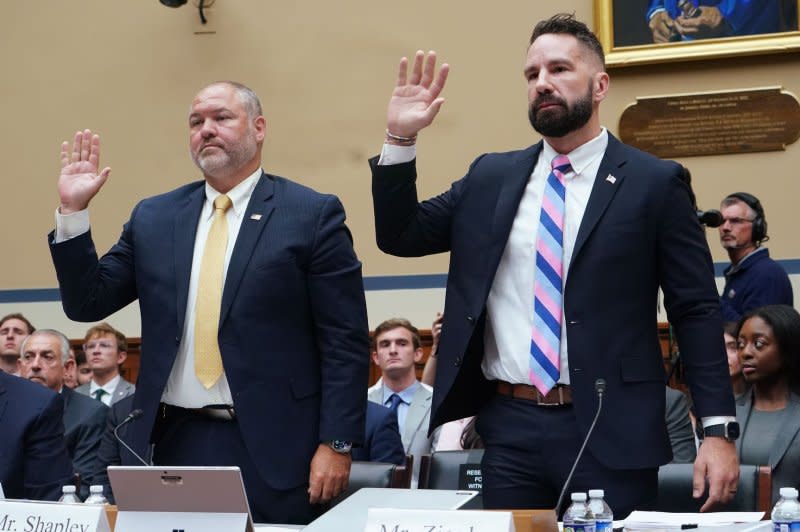 IRS Supervisory Special Agent Gary Shapley (L) and IRS Special Agent Joe Ziegler are sworn-in Wednesday during a House Committee on Oversight and Accountability hearing about alleged misconduct by the Biden administration at the U.S. Capitol in Washington D.C. Photo by Bonnie Cash/UPI