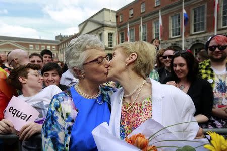 Same-sex marriage supporters kiss at Dublin Castle in Dublin, Ireland May 23, 2015. REUTERS/Cathal McNaughton