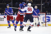 New York Rangers' Pavel Buchnevich (89) hits Washington Capitals' Anthony Mantha (39) with his stick during the second period of an NHL hockey game Wednesday, May 5, 2021, in New York. Buchnevich was penalized for high-sticking. (Bruce Bennett/Pool Photo via AP)