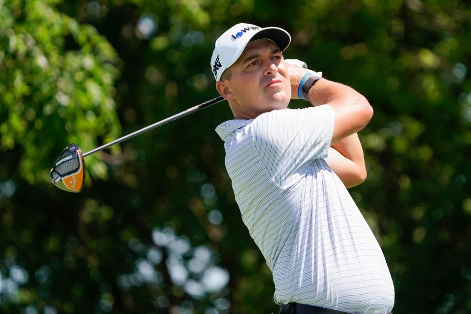 Justin Lower plays his shot from the second tee during the third round of the PGA Tour's AT&T Byron Nelson Classic, May 14, 2022, in McKinney, Texas.