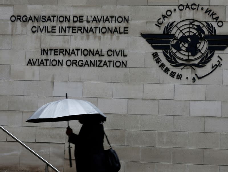 FILE PHOTO: A pedestrian walks past the International Civil Aviation Organization (ICAO) headquarters building in Montreal