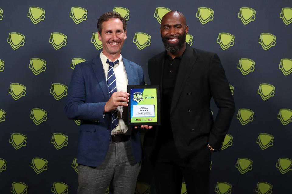 Coach of the Year honoree James Gerdes, the boys soccer coach at Grandview Heights, poses for a photo with former Ohio State and NFL player Malcolm Jenkins at the Central Ohio High School Sports Awards on June 15 at the Ohio Theatre. Jenkins was the guest speaker at the show.