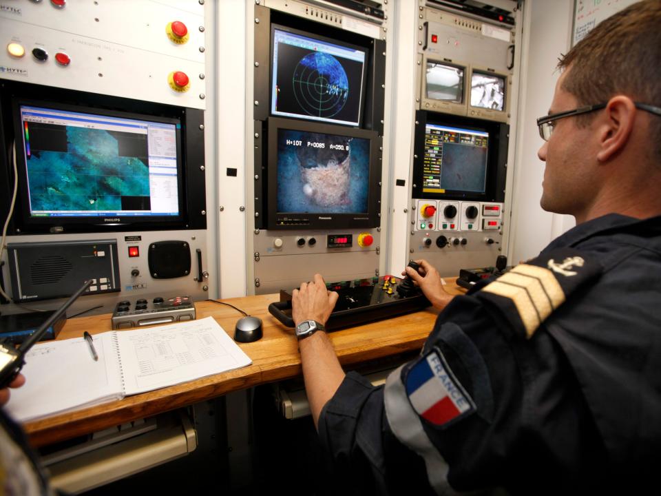 A French navy officer controls a robot during a dive operation in 2012.