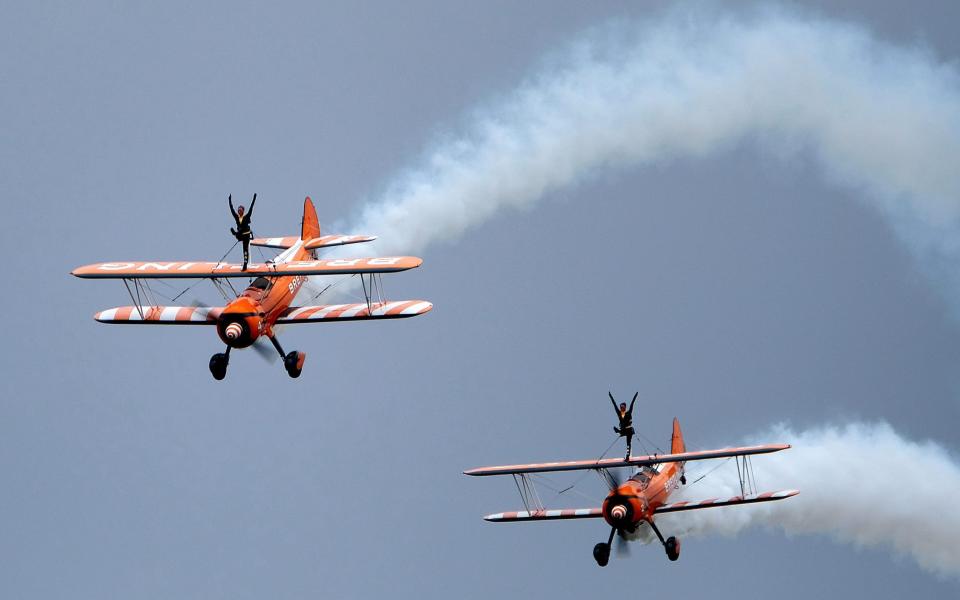 Daredevils: wing walkers demonstrate their skills at the 2017 Scampton Air Show - alamy