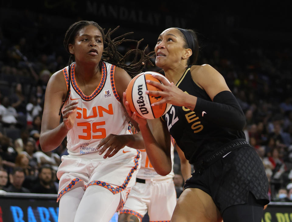 Las Vegas Aces forward A'ja Wilson drives to the basket against Connecticut Sun forward Jonquel Jones during their game on June 2, 2022, at Michelob ULTRA Arena in Las Vegas. The Sun defeated the Aces 97-90. (Ethan Miller/Getty Images)