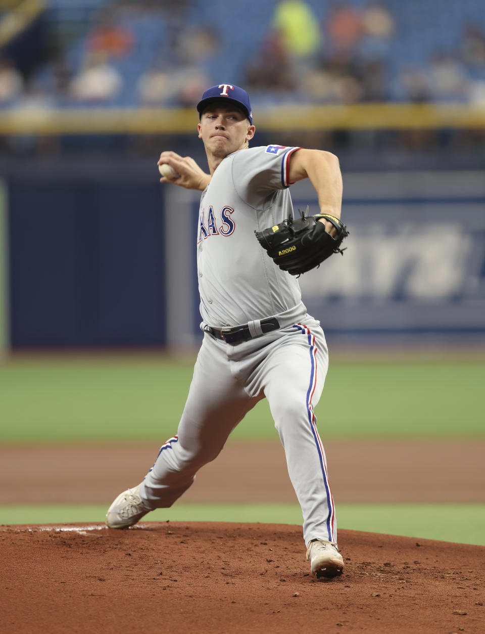 Texas Rangers starting pitcher Glenn Otto delivers a pitch in the first inning of a baseball game against the Tampa Bay Rays, Sunday, Sept. 18, 2022, in St. Petersburg, Fla. (AP Photo/Mark LoMoglio)