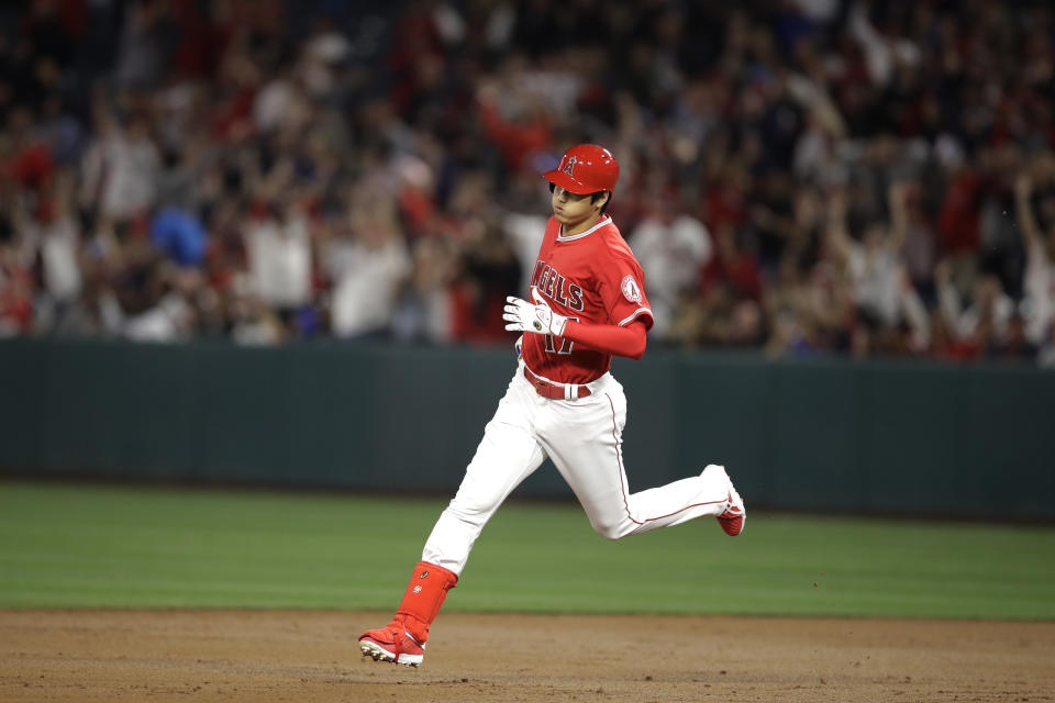 Shohei Ohtani is making noise with his arm and bat right away (AP Photo).