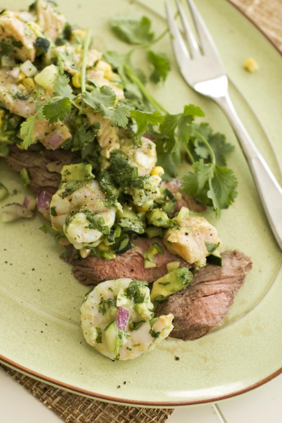 In this image taken on May 13, 2013, a recipe for pepper-lime flank steak with shrimp and salmon ceviche is displayed in Concord, N.H. (AP Photo/Matthew Mead)