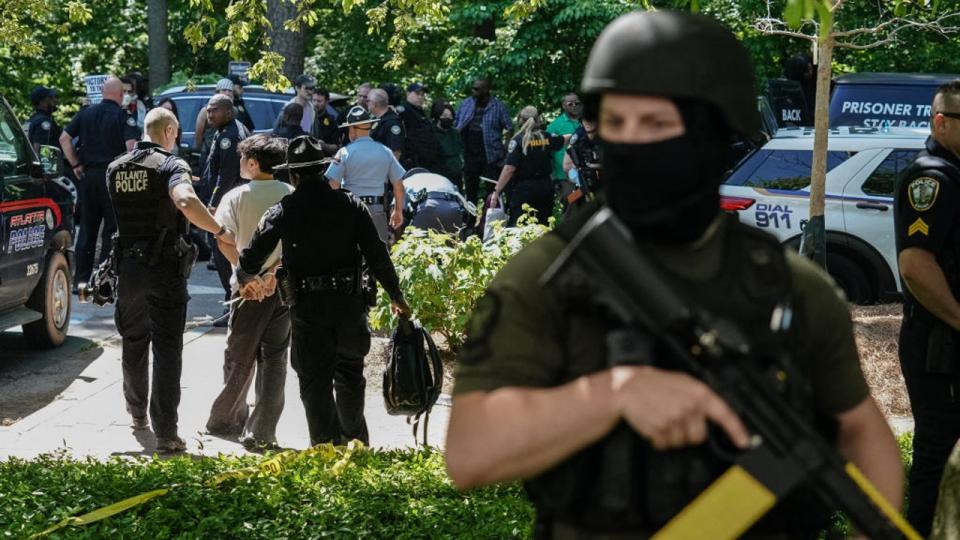 <div>Police officers arrest a protester as pro-Palestinian students demonstrate at Emory University on April 25, 2024, in Atlanta. (Photo by ELIJAH NOUVELAGE/AFP via Getty Images)</div>