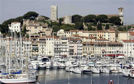 Luxury yachts and boats are moored in the port of Cannes in this May 11, 2009 file picture. REUTERS/Regis Duvignau/Files