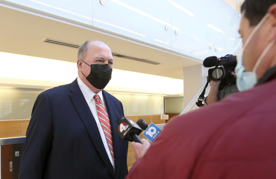 Prosecutor Tim Merkle, left, speaks to reporters at the Franklin County Courthouse following the arraignment of former Franklin County, Ohio, deputy Jason Meade who was indicted on murder charges in the 2020 shooting death of Casey Goodson Jr. in Columbus, Ohio, Friday, Dec. 3, 2021. Meade, who fatally shot Casey Goodson Jr. in the back five times has pleaded not guilty to charges of murder and reckless homicide. (AP Photo/Paul Vernon)