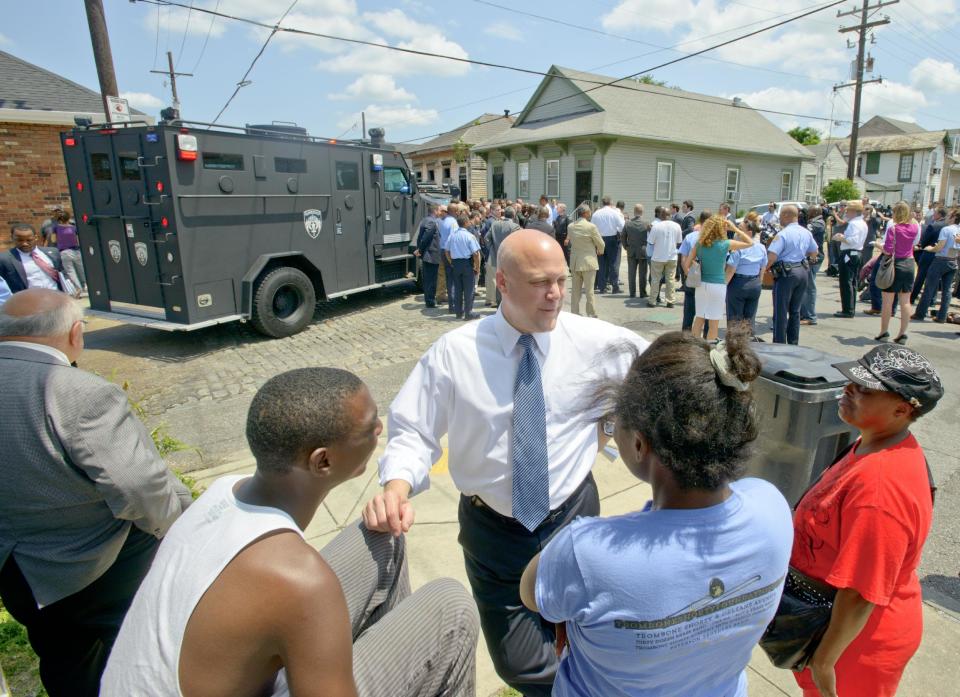FILE - In this May 16, 2013. New Orleans Mayor Mitch Landrieu greets with residents before a news conference at North Villere and Frenchman Streets, where 20 people were shot in a the parade on Mother's Day in New Orleans. Gunfire one boozy Mardi Gras weekend, a mass shooting at a jazz music parade and the gunshot deaths of three children in 2013 nearly overshadowed a promising statistic New Orleans Mayor Mitch Landrieu touts as he seeks re-election Saturday: the city’s murder rate dropped last year by nearly 20 percent. Still, the violence stubbornly continues and crime is a major election issue as Landrieu seeks four more years. Though many voters say they still don’t feel safe, local pundits say Landrieu is positioned to beat two fellow Democrats, with a runoff date of March 15 if needed. (AP Photo/Matthew Hinton, file)