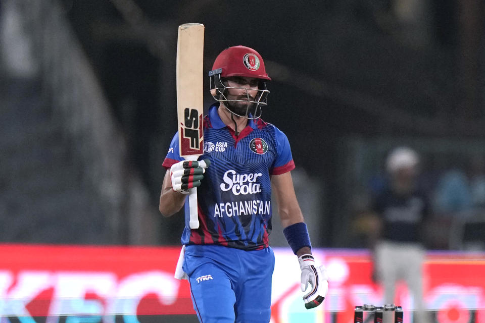 Afghanistan's Ibrahim Zadran celebrates after scoring fifty during the Asia Cup cricket match between Bangladesh and Afghanistan in Lahore, Pakistan, Sunday, Sept. 3, 2023. (AP Photo/K.M. Chaudary)