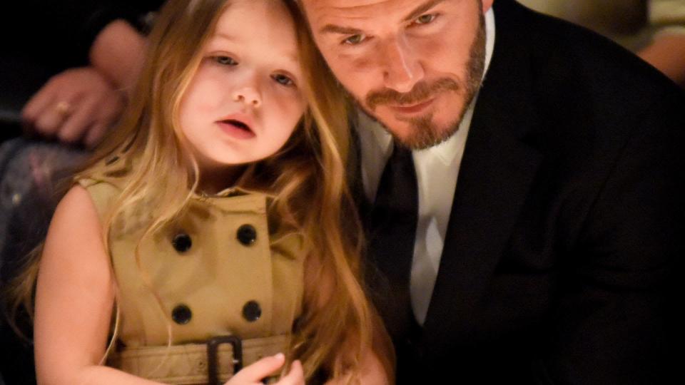 Harper Beckham (L) and David Beckham attend the Burberry "London in Los Angeles" event at Griffith Observatory on April 16, 2015 in Los Angeles, California.